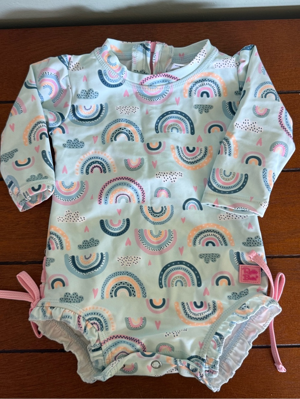 Ruffle Butts Chase the Rainbow One Piece Rash Guard Swimsuit Size 3-6 Months